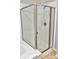 Bathroom shower with glass door and white subway tile surround at 8726 S Kline St # A208, Littleton, CO 80127