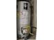 Bradford White Defender Safety System water heater with various energy guides and safety information at 8726 S Kline St # A208, Littleton, CO 80127
