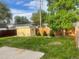 View of backyard with lawn and shed at 894 S Krameria St, Denver, CO 80224