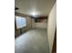 Unfinished basement with concrete flooring and visible ceiling beams, offering potential for renovation at 894 S Krameria St, Denver, CO 80224