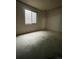 Unfinished basement space with concrete floor and window, ready for customization at 894 S Krameria St, Denver, CO 80224