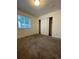 This bedroom with large closet offers a cozy space, filled with light and neutral walls at 894 S Krameria St, Denver, CO 80224