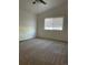 Bedroom featuring vaulted ceiling, ceiling fan, neutral walls and carpeting and a bright window at 894 S Krameria St, Denver, CO 80224