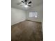 Spacious bedroom featuring a fan, neutral walls, carpeting and a bright window at 894 S Krameria St, Denver, CO 80224