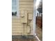 Home's exterior utility meters and wiring at 894 S Krameria St, Denver, CO 80224