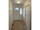 Inviting entryway featuring a closet for storage and tiled floors at 894 S Krameria St, Denver, CO 80224