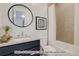 Modern bathroom with a soaking tub, vanity, and a frameless shower at 2732 W 68Th Ave, Denver, CO 80221