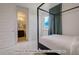 Charming bedroom with a four-poster bed and en-suite bathroom at 2732 W 68Th Ave, Denver, CO 80221