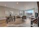 Bright dining area with hardwood floors and a view into the living room at 2732 W 68Th Ave, Denver, CO 80221