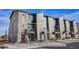 Modern townhome exterior; multiple units with balconies and neutral color palette at 2732 W 68Th Ave, Denver, CO 80221