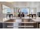 Modern kitchen with stainless steel sink and a view of the living room at 2732 W 68Th Ave, Denver, CO 80221