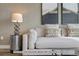 Light beige couch with patterned throw pillows in contemporary living room at 2732 W 68Th Ave, Denver, CO 80221