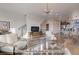 Open living space with hardwood floors, modern furniture, and a view of the kitchen at 2732 W 68Th Ave, Denver, CO 80221