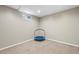 Cozy basement space with small trampoline and neutral decor at 6779 W 79Th Cir, Arvada, CO 80003