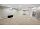 Spacious basement with plush carpet, ample lighting and access to a full bathroom at 6779 W 79Th Cir, Arvada, CO 80003