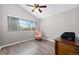 Bright bedroom featuring a window, ceiling fan, and hardwood floors at 6779 W 79Th Cir, Arvada, CO 80003