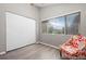 Bedroom featuring a sliding door closet, a window and hardwood floors at 6779 W 79Th Cir, Arvada, CO 80003