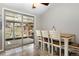 Cozy dining area with a sliding glass door leading to an outdoor patio and play area at 6779 W 79Th Cir, Arvada, CO 80003