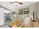 Bright dining area with sliding glass doors, modern table and chairs for Gathering meals at 6779 W 79Th Cir, Arvada, CO 80003