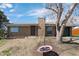 Charming brick home with a well-maintained lawn and mature tree creating a warm and inviting curb appeal at 6779 W 79Th Cir, Arvada, CO 80003