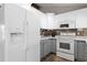 Charming kitchen with two-tone cabinets, sleek appliances, and ample countertop space at 6779 W 79Th Cir, Arvada, CO 80003