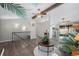 Beautiful living area with wood floors, ceiling fan and staircase, seamlessly connecting multiple spaces at 6779 W 79Th Cir, Arvada, CO 80003