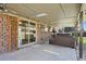 Covered patio is great for entertaining and features string lights, a mounted TV and a hot tub, maximizing outdoor living space at 6779 W 79Th Cir, Arvada, CO 80003