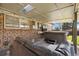 Covered patio features a hot tub, TV, and comfortable seating, perfect for outdoor relaxation and entertainment at 6779 W 79Th Cir, Arvada, CO 80003