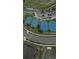 Aerial view of the tennis and pickle ball courts near the golf course with parking for both at 7713 S Zante Ct, Aurora, CO 80016