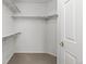 Walk-in closet offering ample storage with built-in shelving and hanging rods at 7713 S Zante Ct, Aurora, CO 80016