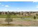 Picturesque golf course with lush green fairways and serene water features create a relaxing atmosphere at 7713 S Zante Ct, Aurora, CO 80016