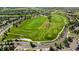 Aerial view of a lush golf course surrounded by well-maintained homes in a desirable community at 7713 S Zante Ct, Aurora, CO 80016