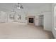 Bright living room boasting neutral walls, a tiled fireplace, and expansive space for entertaining at 7713 S Zante Ct, Aurora, CO 80016