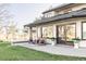 Backyard patio with comfortable seating, outdoor plants, and views of a well-maintained lawn at 10690 County Road One, Longmont, CO 80504