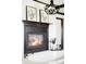 Beautiful bathroom featuring a fireplace, soaking tub, and decorative lighting, creating a relaxing retreat at 10690 County Road One, Longmont, CO 80504