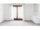 Bright bedroom with a sliding glass door and built-in cabinets, offering a serene and organized space at 10690 County Road One, Longmont, CO 80504