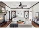 Stylish bedroom with fireplace, seating area, and built-in shelving at 10690 County Road One, Longmont, CO 80504