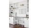 Bright playroom with desk space with cabinets, shelving, and seating at 10690 County Road One, Longmont, CO 80504