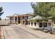 Elegant home exterior with a multi-car garage and stone accents on a well-maintained lot at 10690 County Road One, Longmont, CO 80504