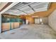 Inside a large garage featuring horse stalls, storage, and multiple garage doors at 10690 County Road One, Longmont, CO 80504