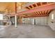Inside a large garage featuring storage, workbench, and high ceilings at 10690 County Road One, Longmont, CO 80504