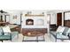 Inviting living room with a painted brick fireplace, wood mantel, and neutral accents at 10690 County Road One, Longmont, CO 80504