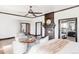 Spacious primary bedroom features fireplace, seating area, and large windows at 10690 County Road One, Longmont, CO 80504