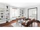 Stylish home office with custom bookshelves, wood floors, and bright natural light at 10690 County Road One, Longmont, CO 80504
