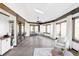 Bright sunroom with vaulted ceilings, skylights, and large windows offering scenic views at 10690 County Road One, Longmont, CO 80504