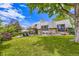 Expansive backyard with lush green lawn and a patio space, great for entertaining at 3378 Mowry Pl, Westminster, CO 80031