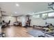Finished basement featuring modern gym equipment and a cozy lounge area at 3378 Mowry Pl, Westminster, CO 80031