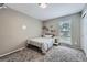 Bright and airy bedroom featuring neutral walls, carpet, and a large window for natural light, creating a welcoming space at 3378 Mowry Pl, Westminster, CO 80031