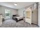 Bedroom featuring neutral walls, plush carpet, a large window, and bright white furniture, offering comfort and style at 3378 Mowry Pl, Westminster, CO 80031