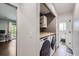 Convenient laundry room with modern washer and dryer, ample counter space, and storage, seamlessly connecting to other areas at 3378 Mowry Pl, Westminster, CO 80031